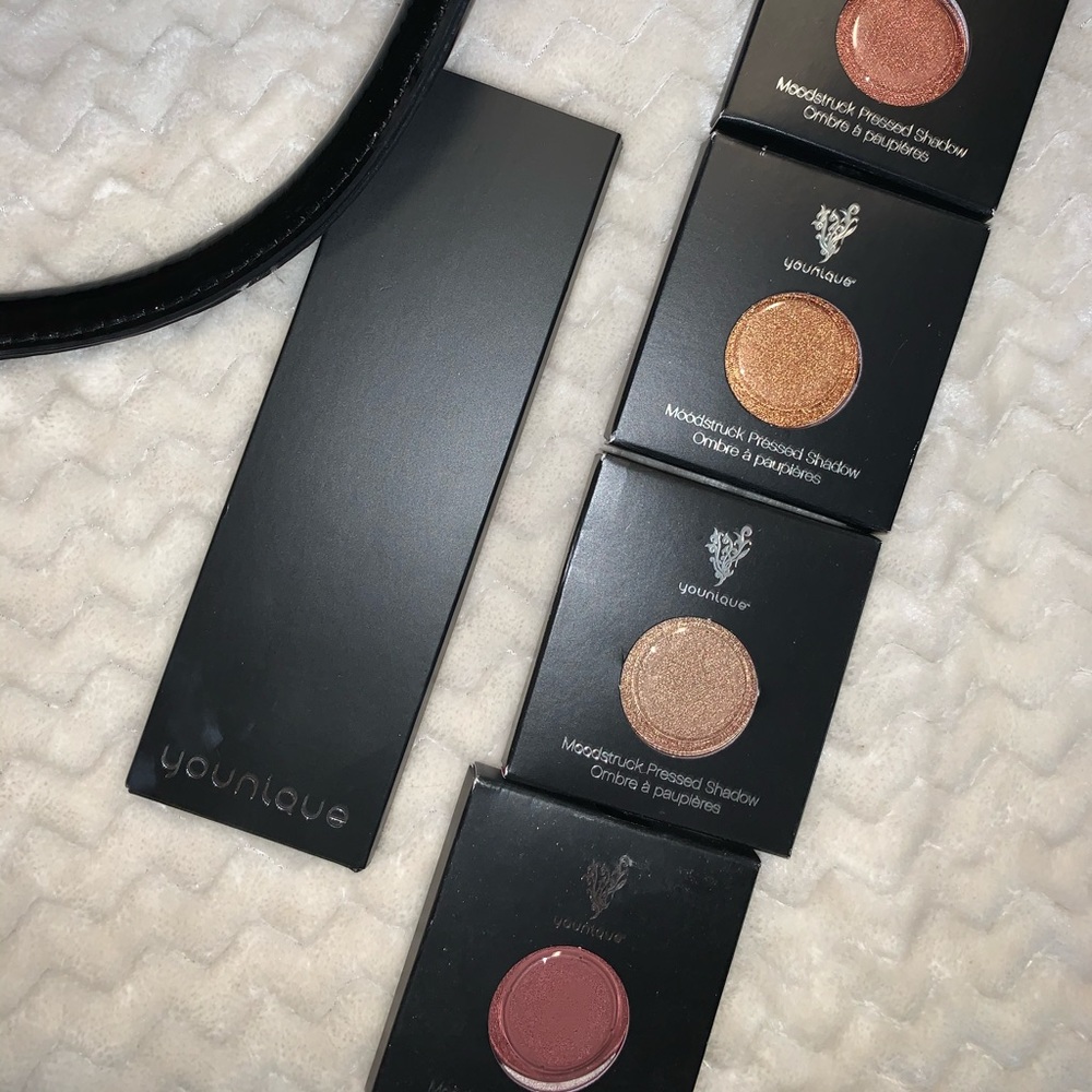 Brand new 4 eyeshadows & refillable palette